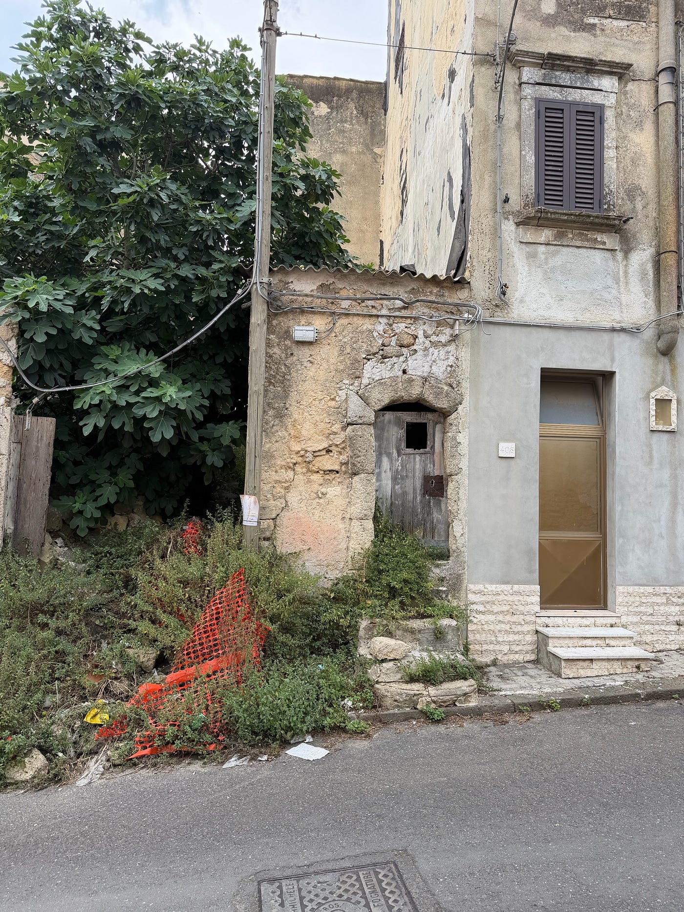 A Crumbling Staircase. An Arched Doorframe. No Windows. Sicily.