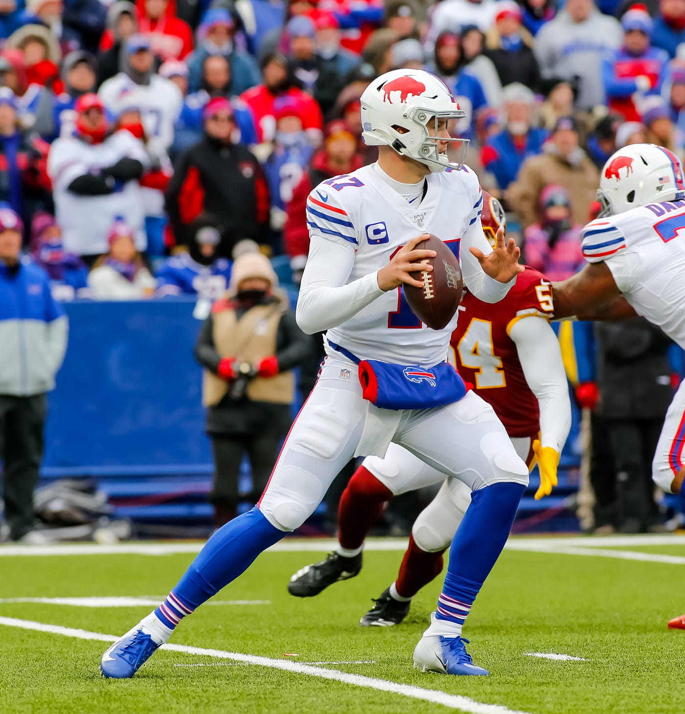 Buffalo Bills’ franchise quarterback Josh Allen (17) stands tall in the pocket preparing to step and throw a pass during a previous NFL game between the Bills and the Washington Redskins (now the Commanders) on Sunday, November 3, 2019, in Orchard Park, New York. (Photo via All-Pro Reels licensed under C.C. by SA 2.0)