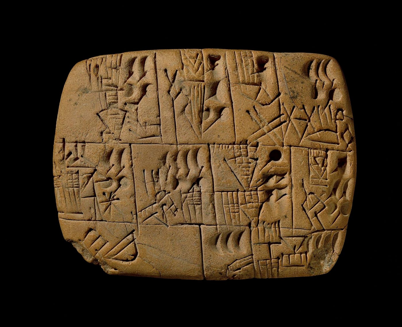 In ancient Mesopotamia, cuneiform was created by pressing a wedge-shaped stylus into soft clay tablets, resulting in sharp, angular forms. Image source: Smarthistory. https://smarthistory.org/cuneiform/