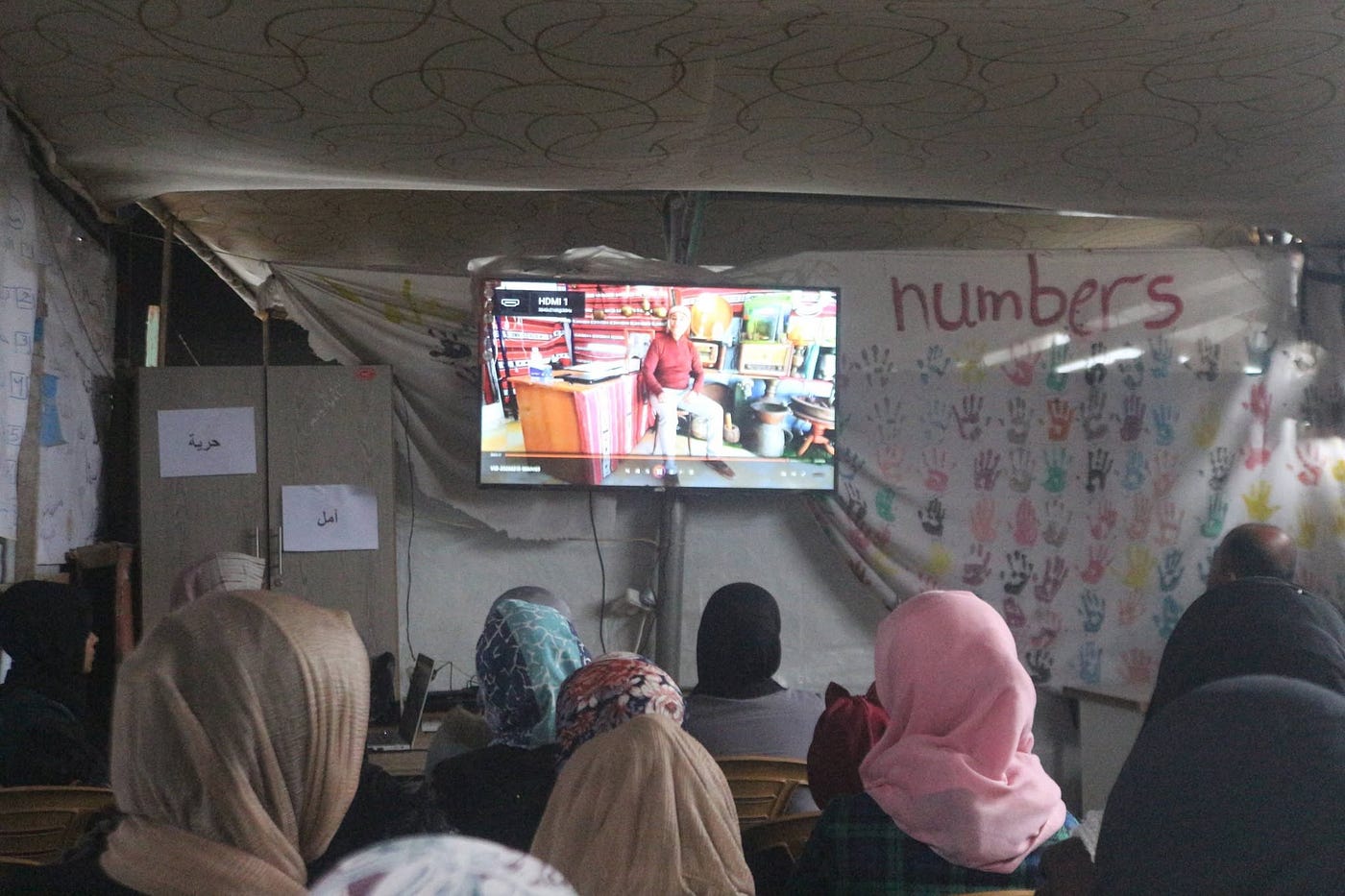 Gaza Story: Children Smiling Inside a Tent Cinema Amid War and Displacement