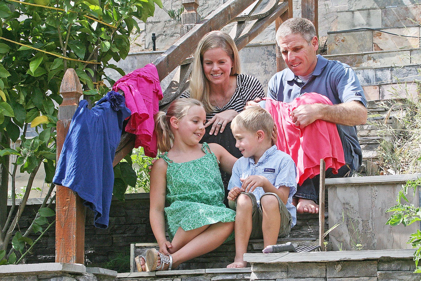 Rhett Krawitt sits with dad Carl, mom Jodi and sister Annesley in May 2014 in their East Corte Madera home, just before Annesley was to serve as a sibling honoree and model in a Leukemia & Lymphoma Society fundraiser in San Francisco. The Krawitts are seeking to raise awareness about the community importance of vaccinations because their own son is medically unable to get them. (Elliot Karlan / For The Ark)