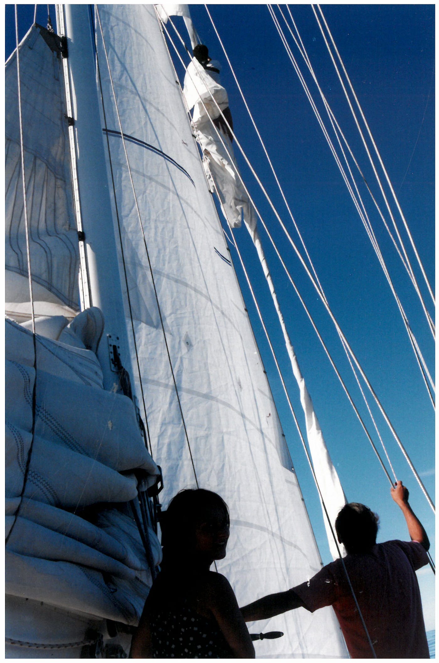 The captain high above the deck, untangling the sail after the storm, my photo