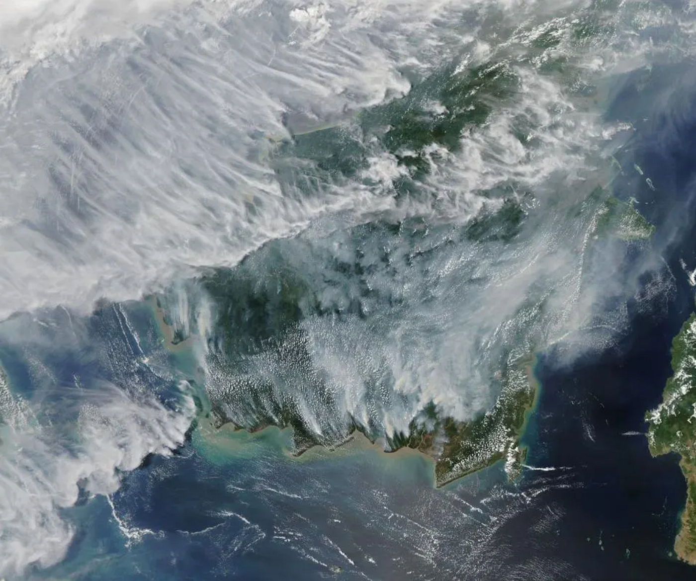 This satellite image depicts a hellscape that was once a huge rainforest in Kalimantan (part of Borneo) and Sumatra before it was burned by wildfires in September 2019. (Credit: Joshua Stevens, NASA / LANCE MODIS Rapid Response)