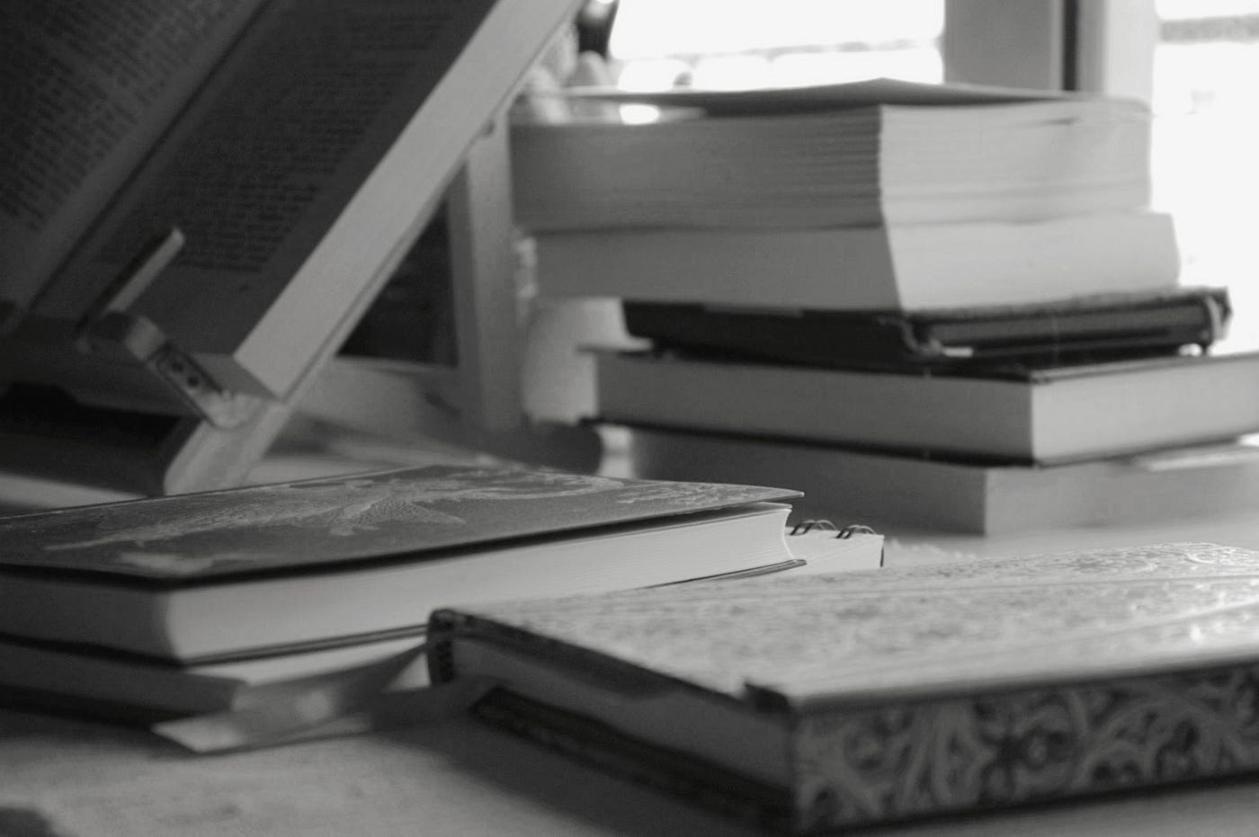 A stack of books on the table. Photo taken by Diana Dolea.