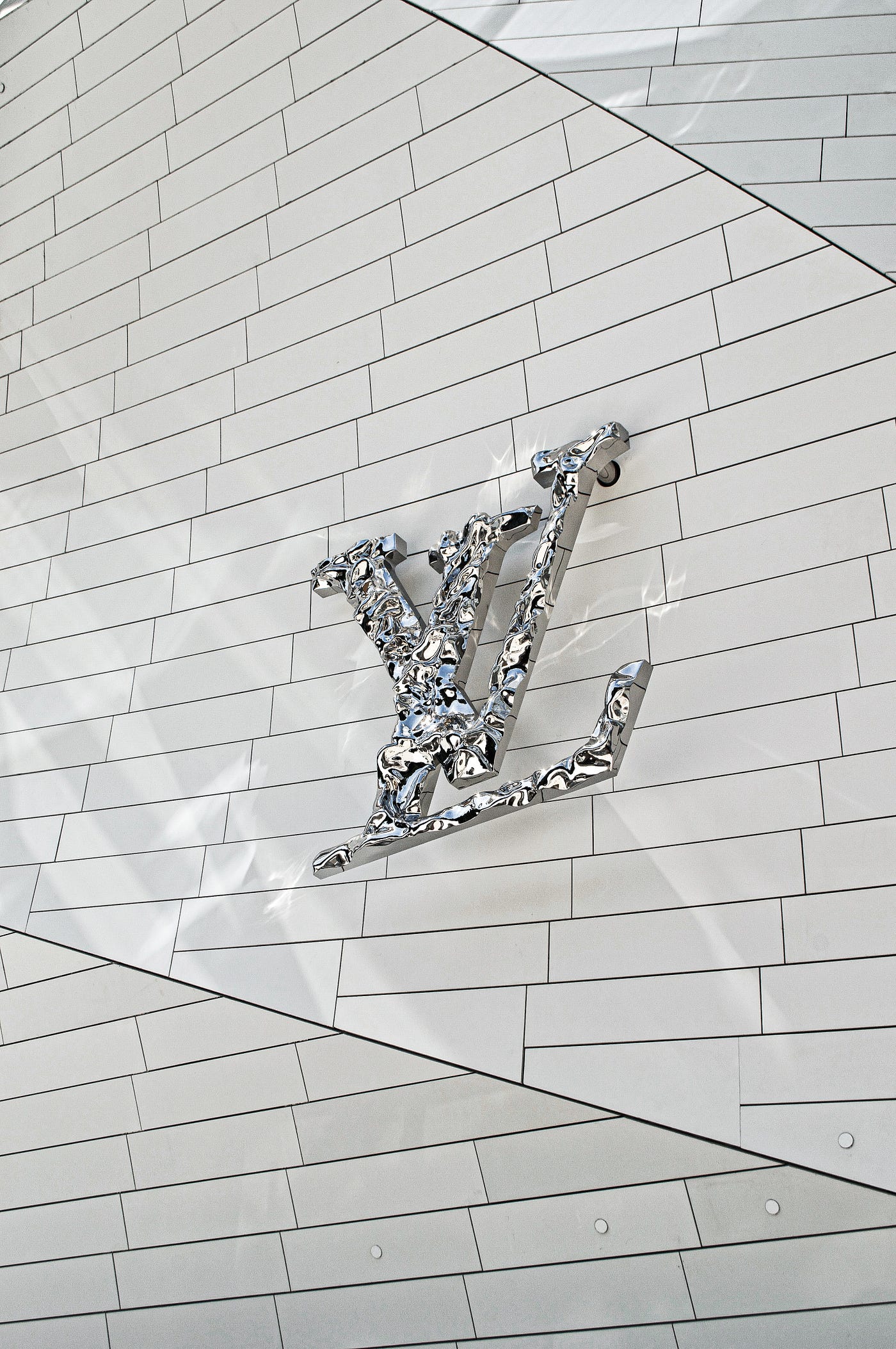 Louis Vuitton's Monogram V as a symbol of French chic and impeccable  craftsmanship