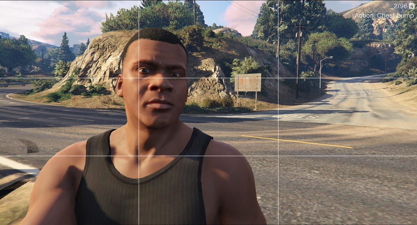 Provided GTA V in-game image showing a T-junction with STOP marking and mountainous terrain used for geolocation analysis