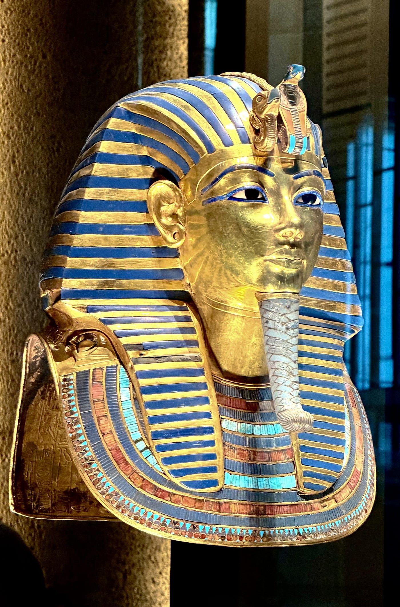 Left: The 36-foot-high statue of Rameses II stands in the atrium entrance hall. Right : The golden mask of Tutankhamen. Photos: David A. Laws