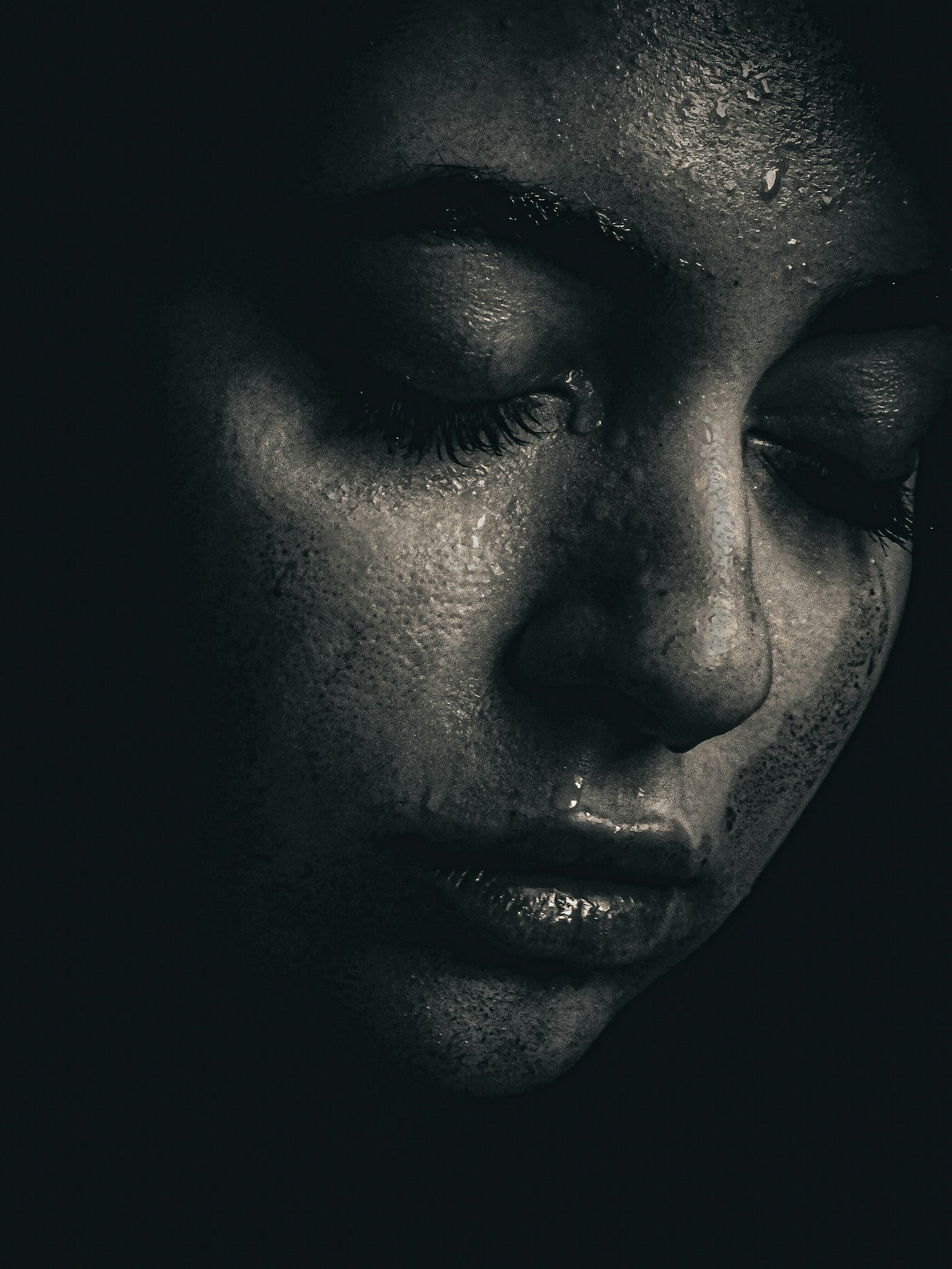 Source: https://unsplash.com/photos/a-black-and-white-photo-of-a-womans-face-KTxKgXDVoCU — Photographer: Reza Shahriari