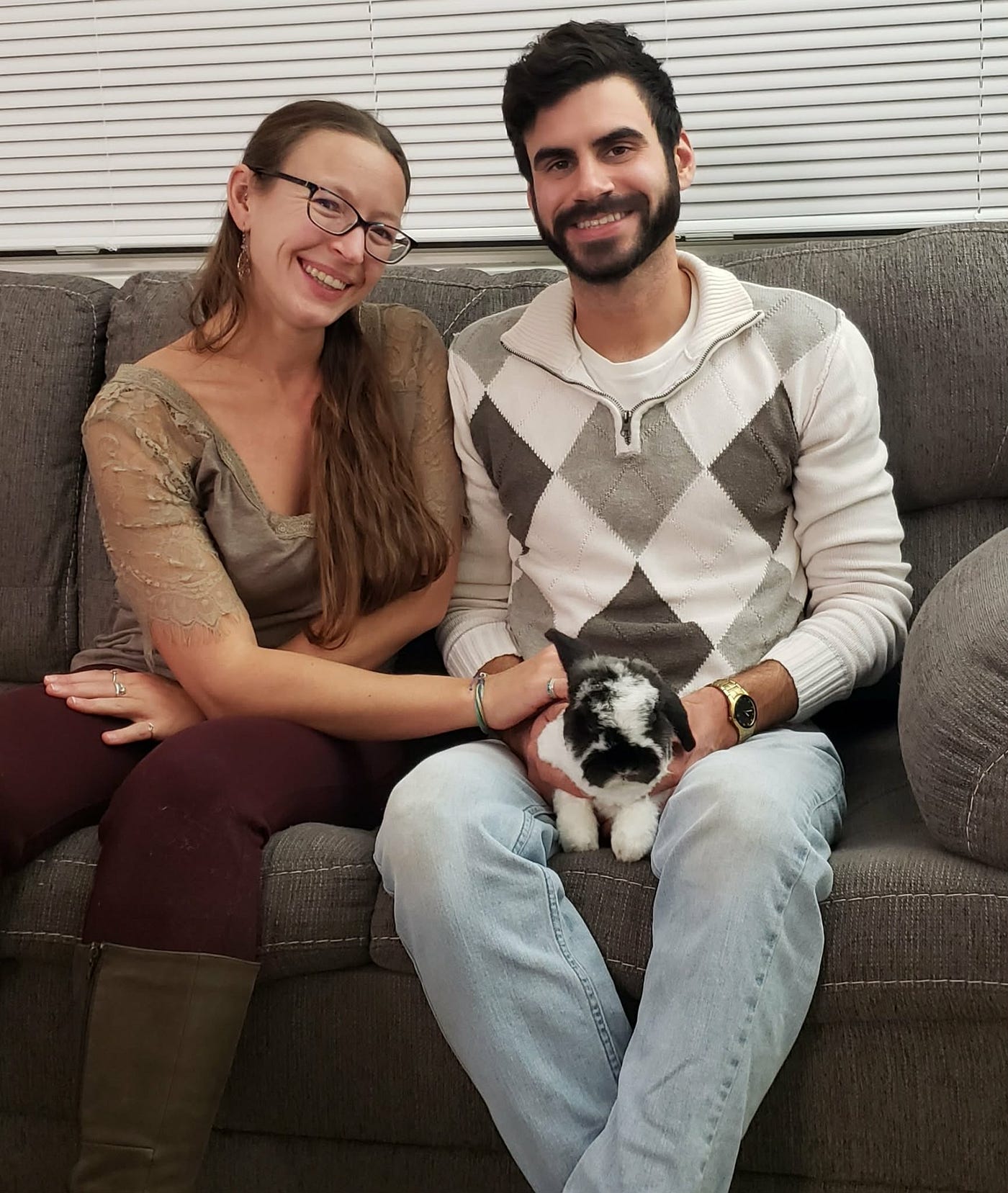 Alex and her boyfriend, Eric (last name withheld upon request), are holding one of my rabbits, Charlene (last name withheld upon request) (Photo by the author)