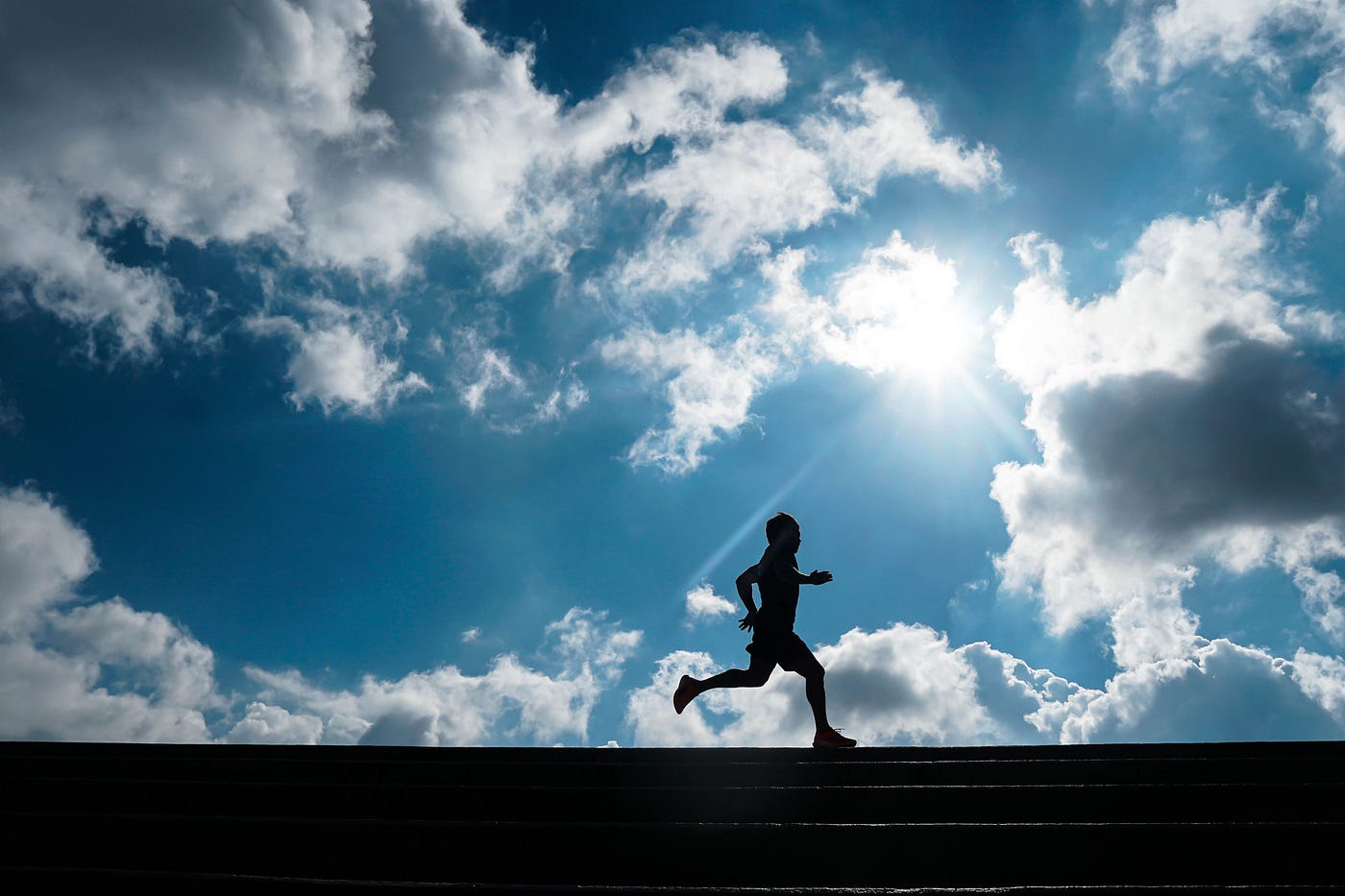 Photo by Caique Araujo: https://www.pexels.com/photo/a-man-running-under-the-sky-10439806/