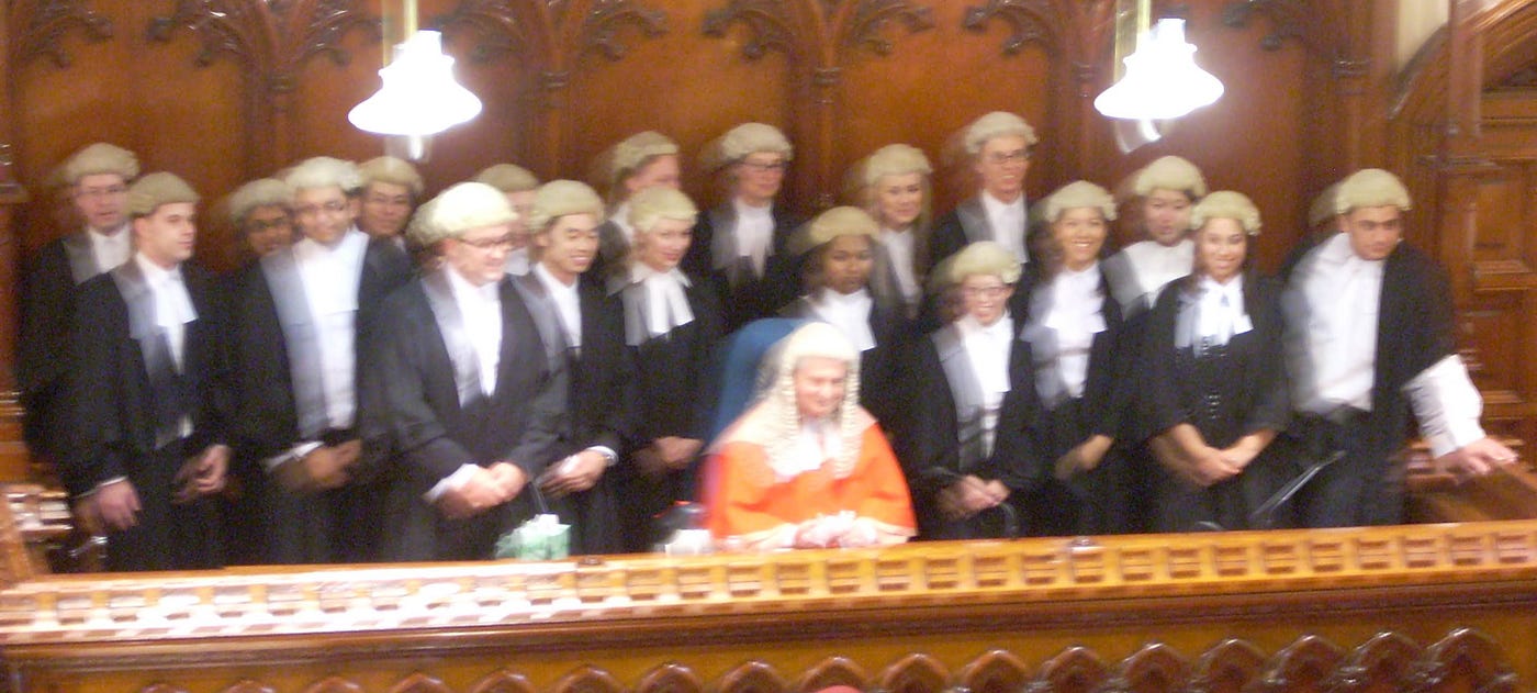 Image of my cohort of lawyers being admitted to the Bar. I’m peeking out from the back row.