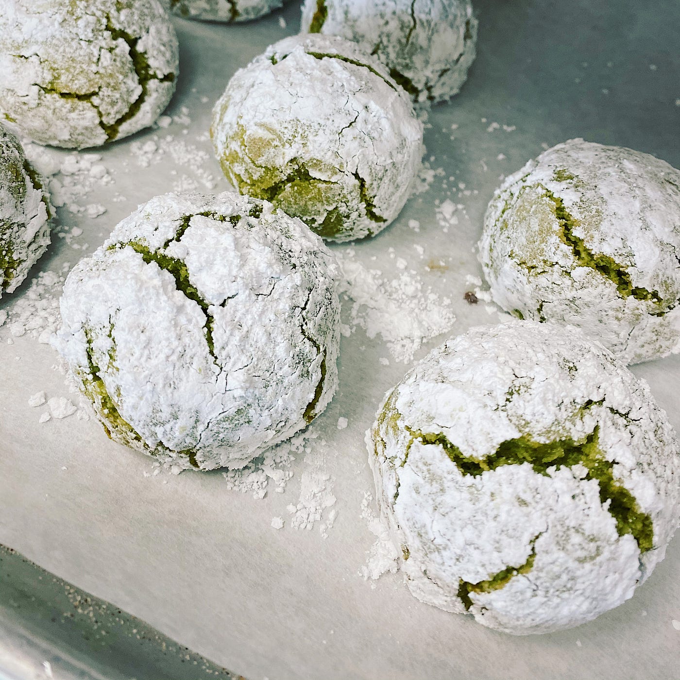 Snowball cookies made with green dough.