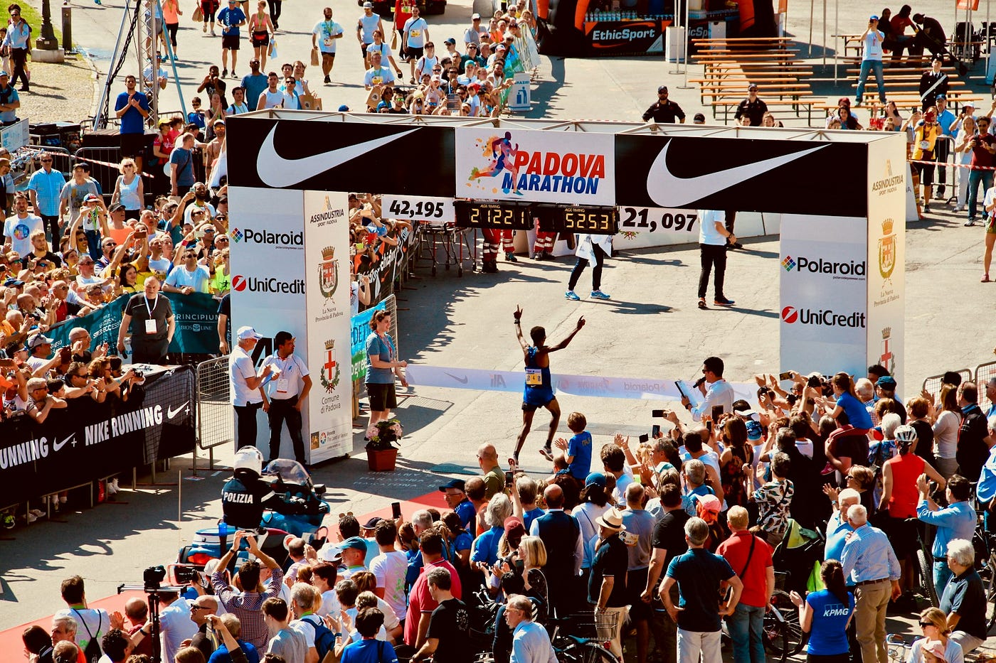 Runner crossing the finish line at a marathon