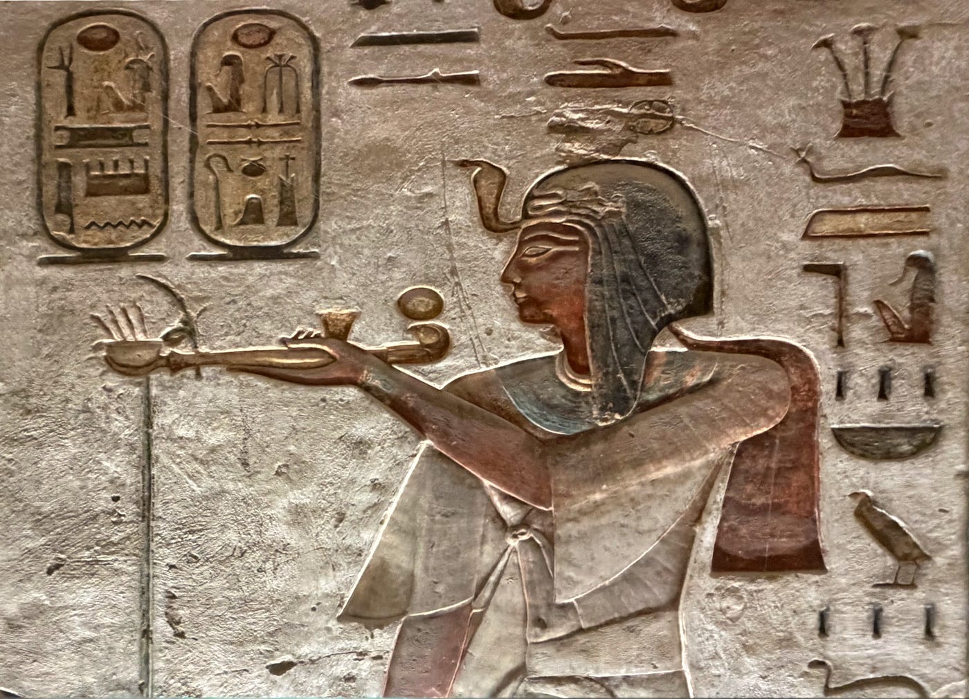 Left: Jackal head figures of Anubis in KV2 (Tomb of Rameses IV) Right: Pharaoh Seti I holding a censer in KV 11 (Tomb of Rameses III) Photos: David A. Laws