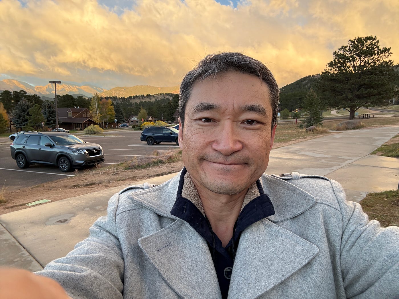 I took a selfie, Oct 2025, at Estes Park, CO & the mountains said…