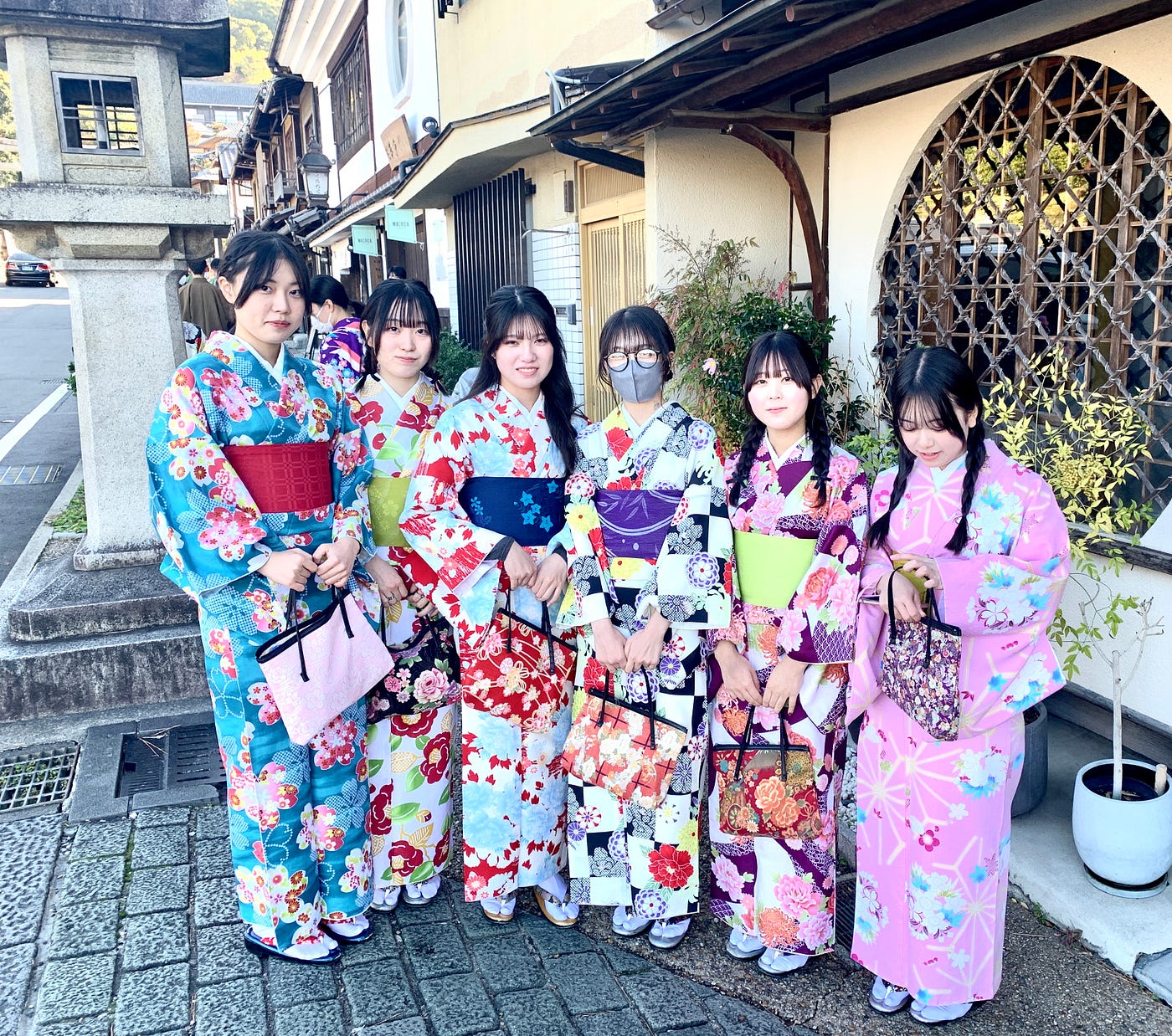 Thoughtful woman in traditional kimono showcasing the mindful and contemplative state that wearing kimono naturally encourages