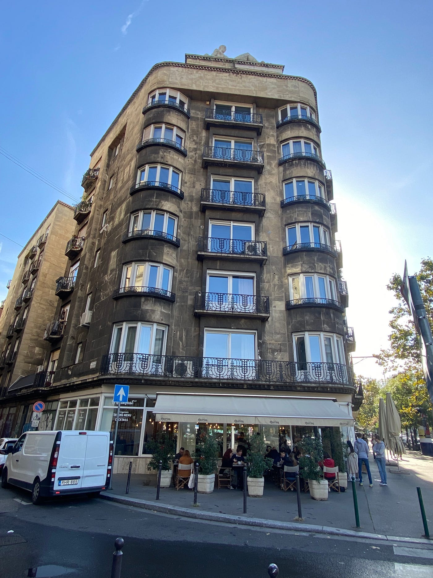 Captain Cook Pub, a wet street, an apartment building with bay windows.