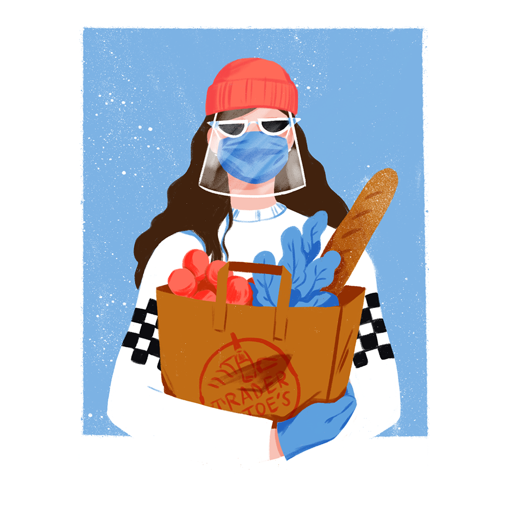 Woman wearing face mask and face shield and sunglasses with Trader Joe’s groceries in her arms.
