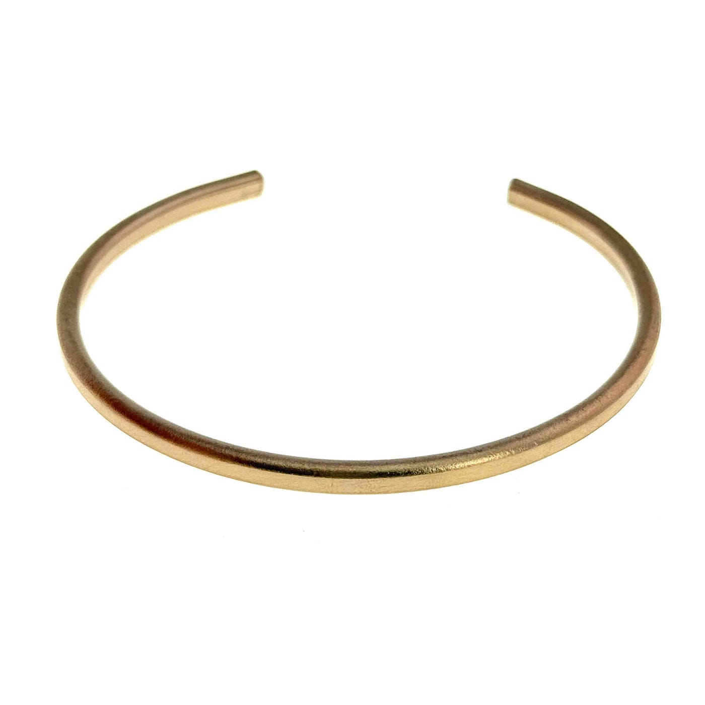 Bronze grows richer with wear, developing a natural patina that gives each handcrafted cuff its own warm character over time.
