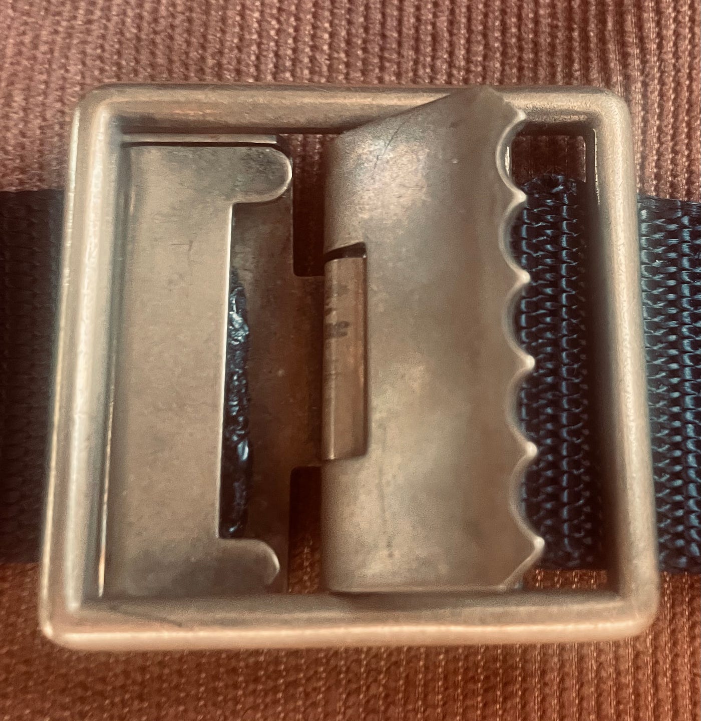 The neighbor who gave the enduring belt buckle