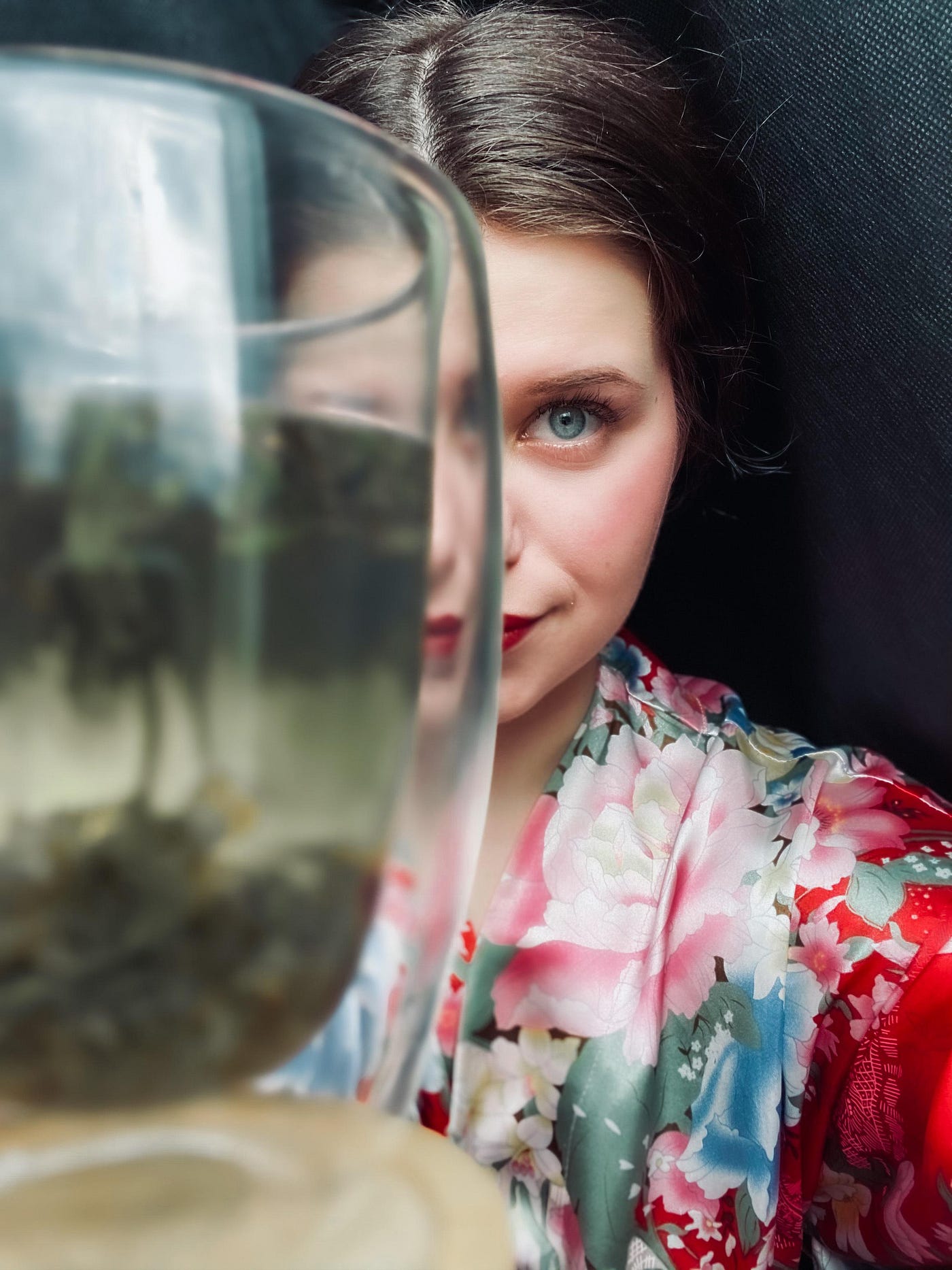Beautiful brunette studies a cup of jasmine tea _ Apl on Pixabay