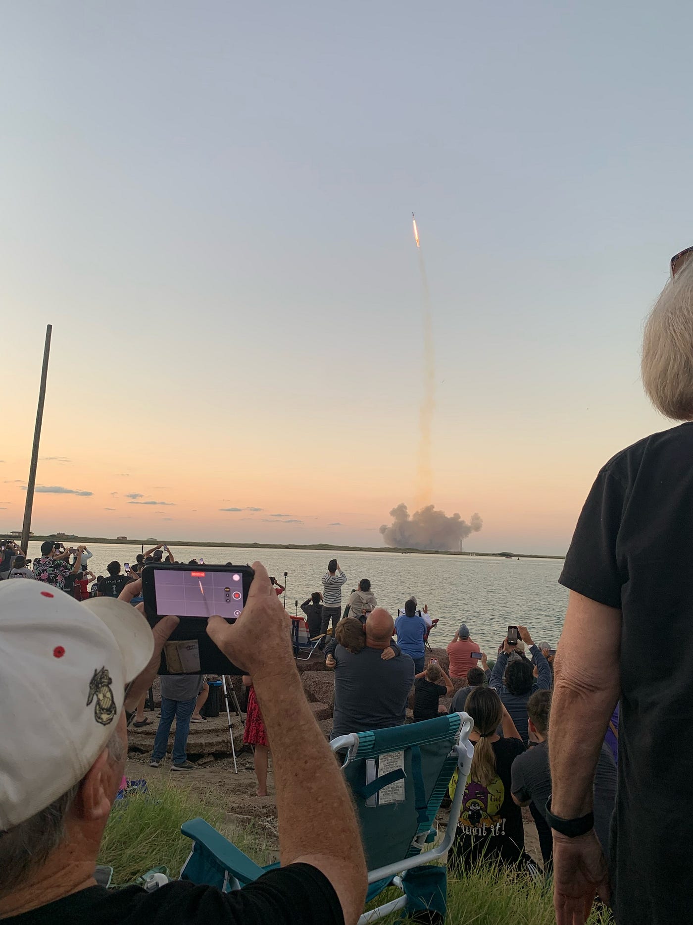Crowd watching Space X launch on the jetties South Padre Island. Photo by author