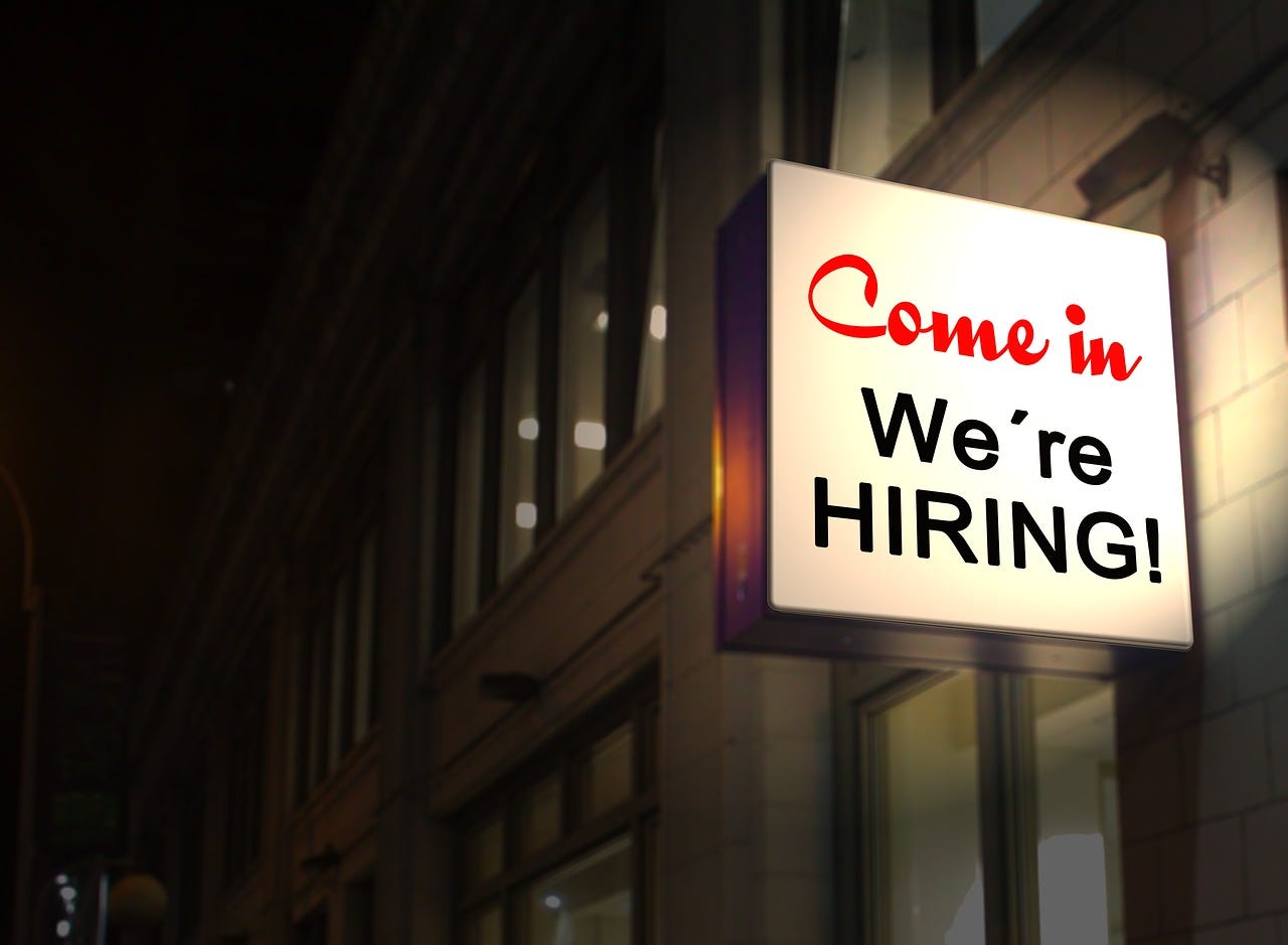 A billboard with ‘Hiring’