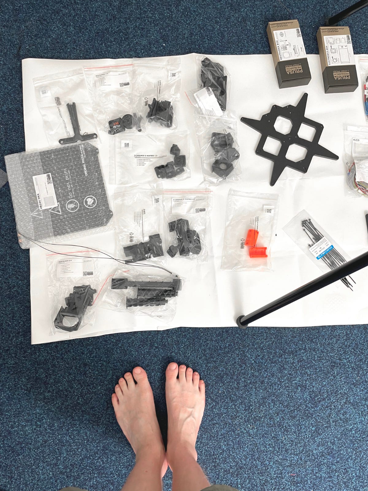 Me, laying out all the necessary parts to shoot the manual on the floor.