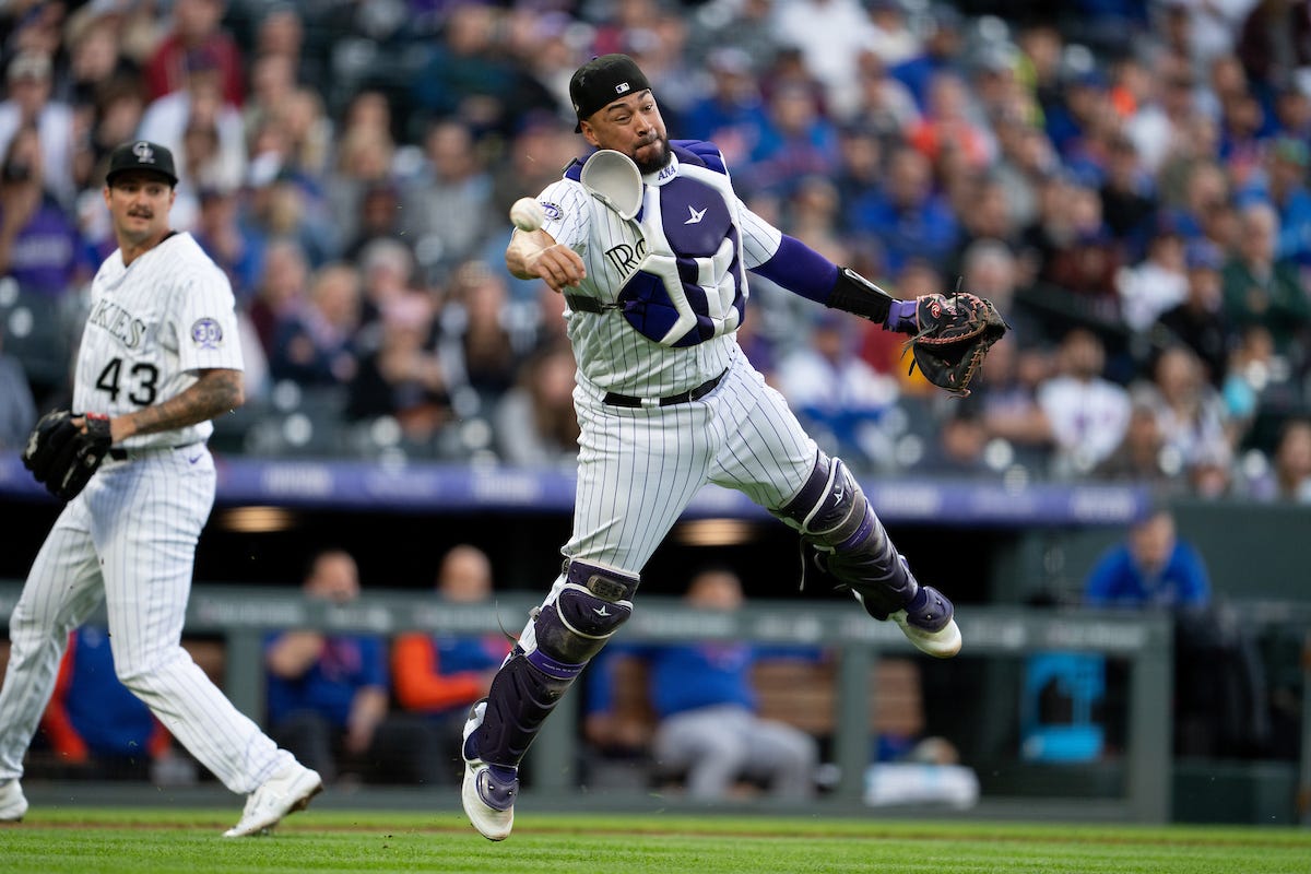 Here to help: Rockies catcher Elias Diaz extends a hand to his