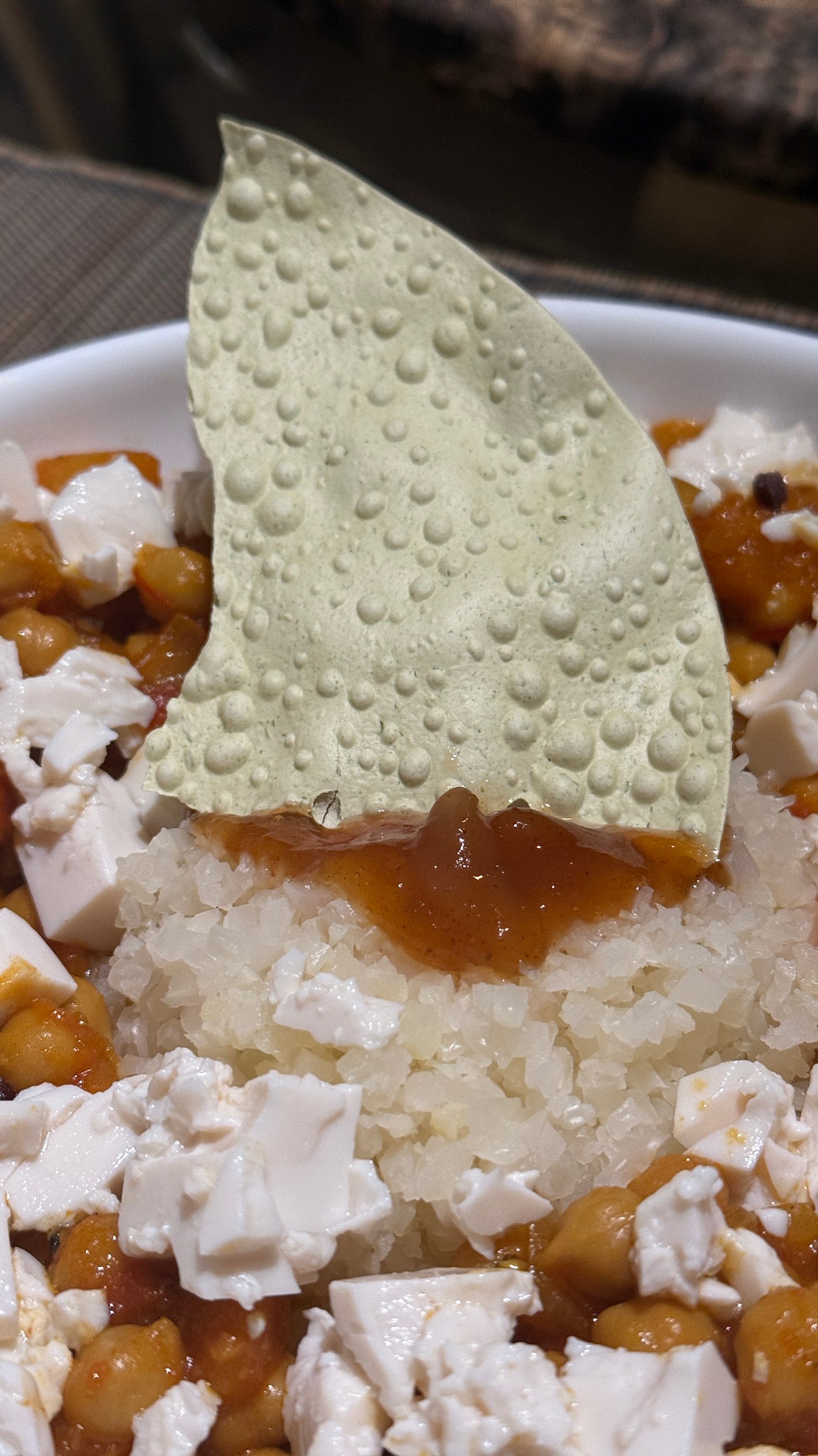 Rustic butternut and chickpea curry with diced silken tofu — gentle heat, golden color, and balance restored.