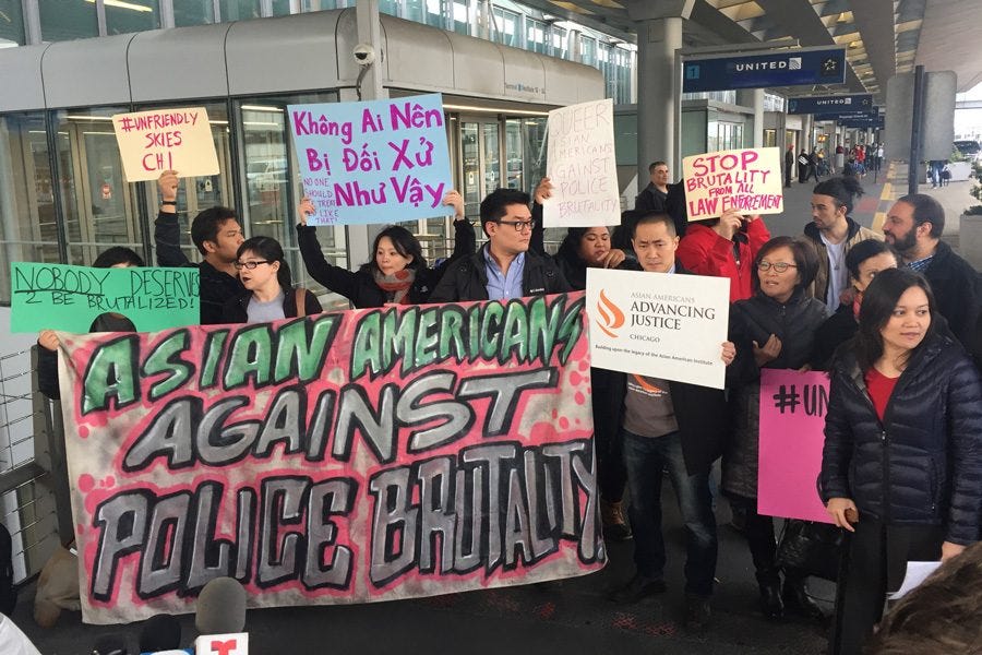 Protesters outside San Francisco International Airport. They’re holding banners and signs like “Asian Americans against police brutality,” “stop brutality from all law enforcement,” and “no one deserves to be treated like this.”