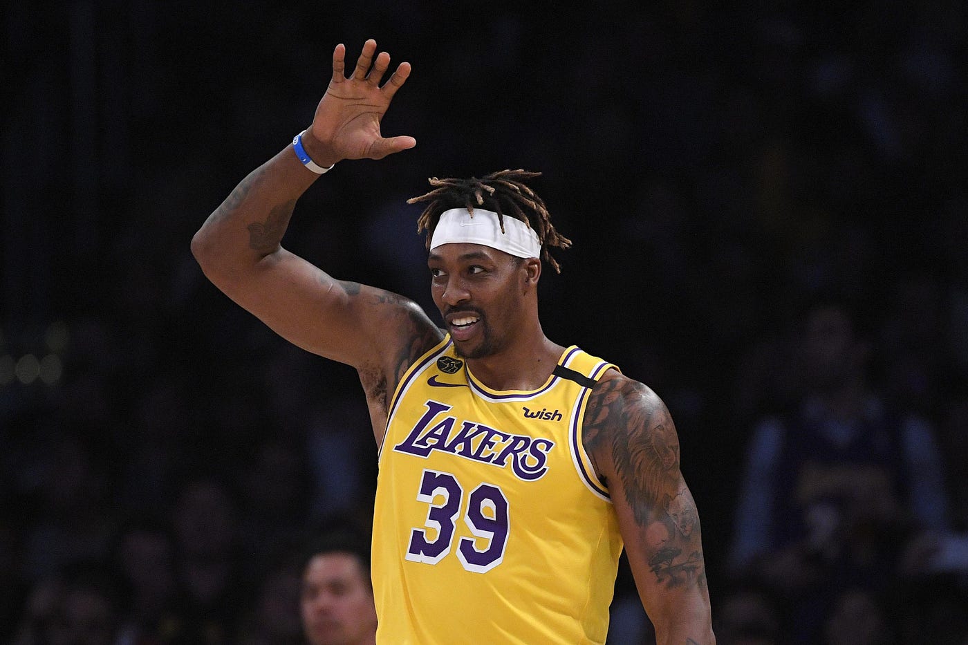Dwight Howard brings energy to Lakers' bench, while trying to