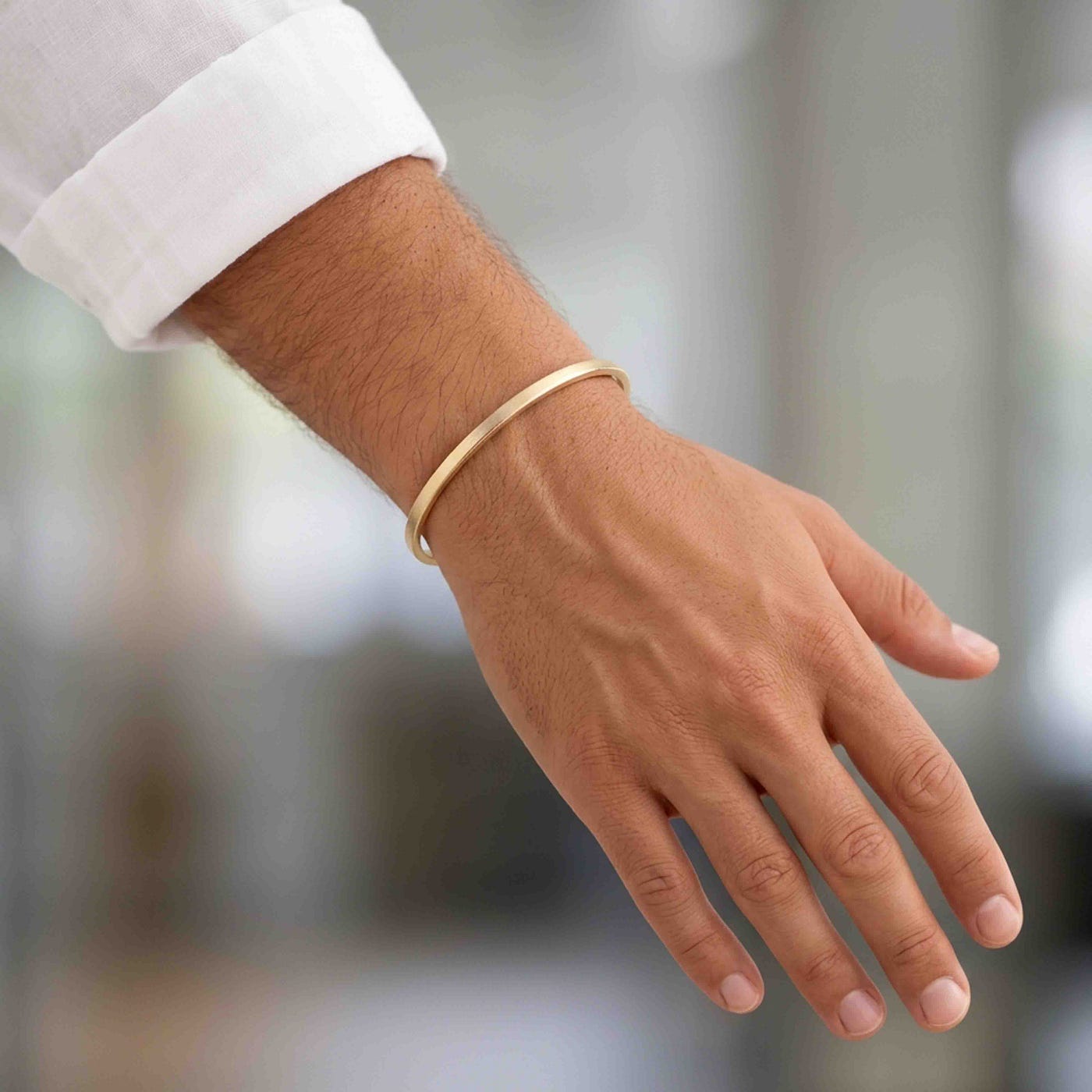 A warm bronze cuff carries heartfelt meaning, making it a simple and stylish way to celebrate eight years together.