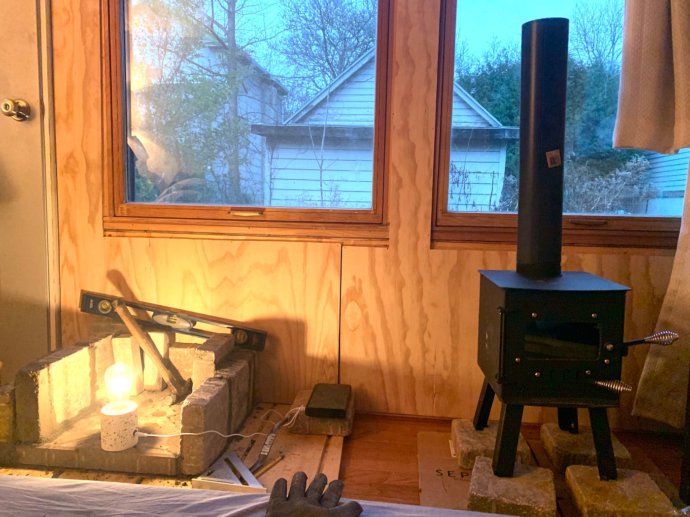 Tiny Wood Stove - When installing a tiny wood stove, chances are there  isn't much room to spare in the first place. But with an adequate heat  shield, the space you need