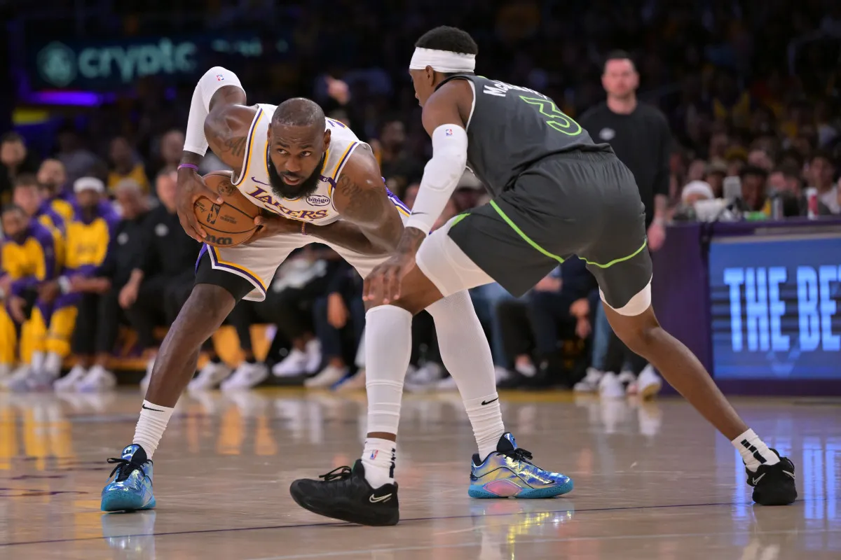A photograph of Jaden McDaniels, Timberwolves’ Forward, defending LeBron James in Game 3 of the 2025 NBA Playoffs.