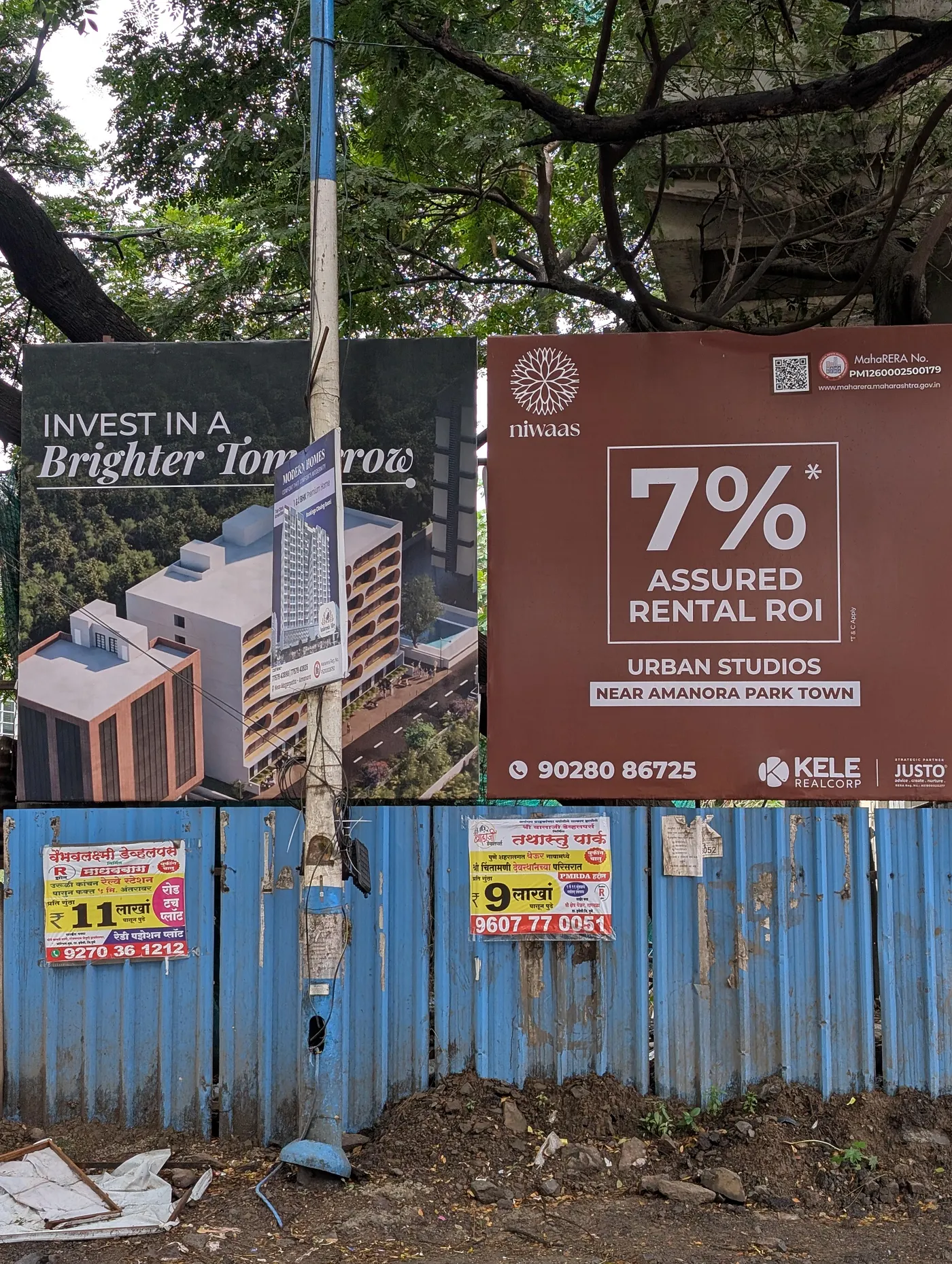 Billboards promoting investment in rental properties and urban studios, reflecting the growing real estate market amid rising rents.