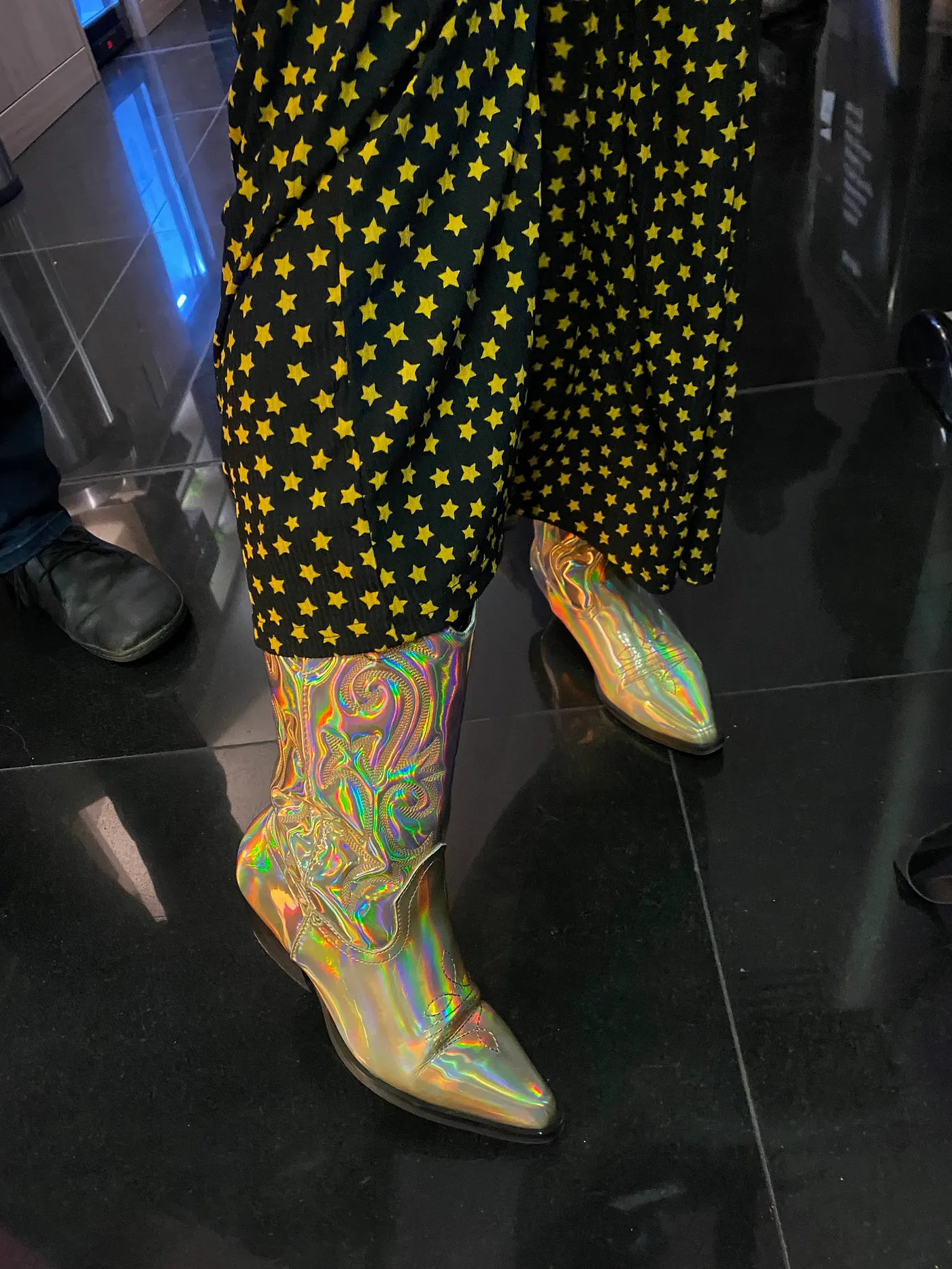 A sparkly pair of trousers and an iridescent pair of boots