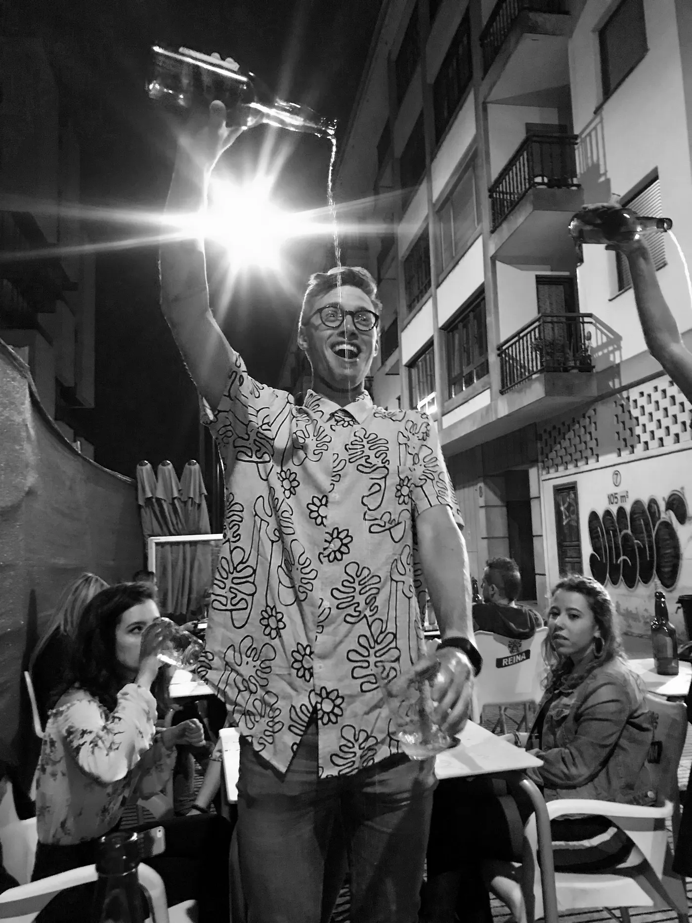 Me trying my hand at pouring cider while unimpressed locals watch