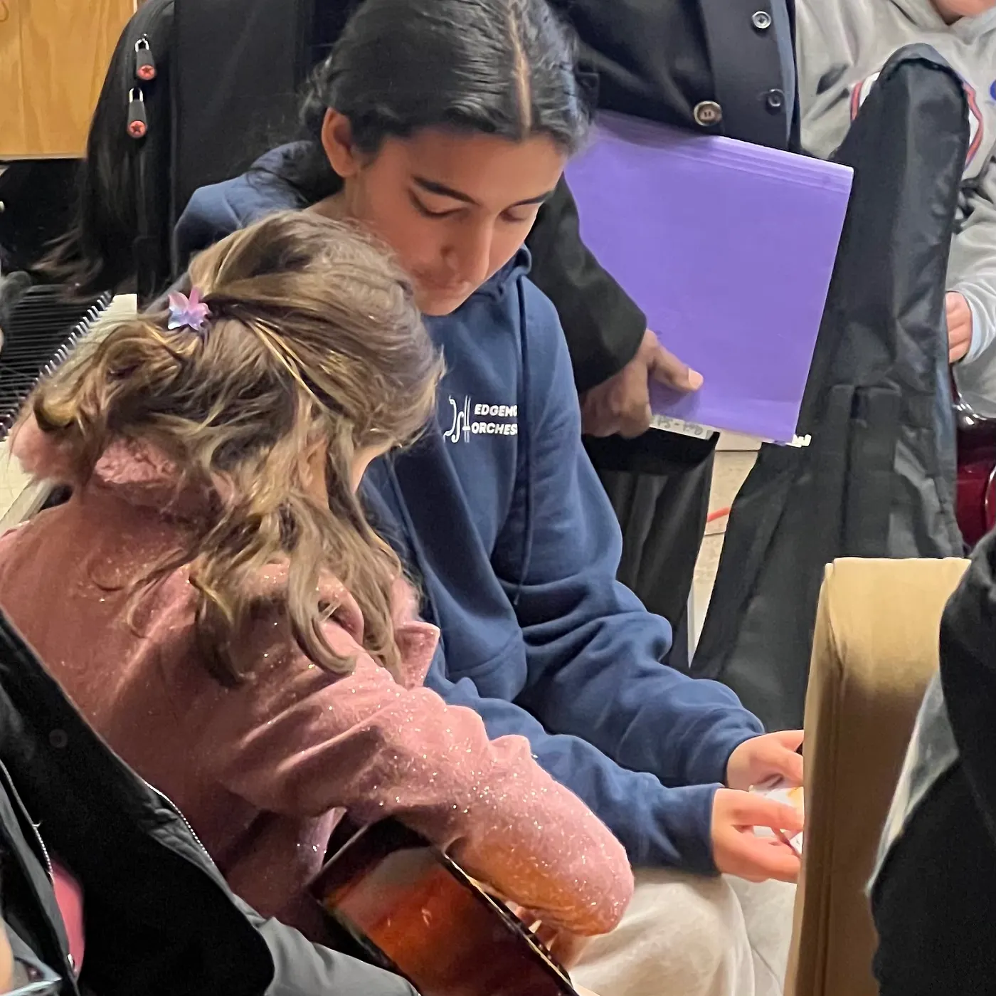 Zoya teaching guitar