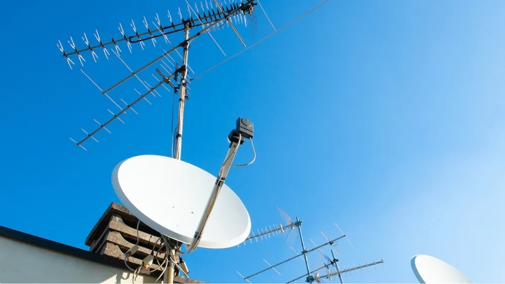 Rooftops covered in satellite dishes