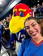 A girl poses with Baby Jay.