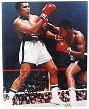 Muhammad Ali on the left