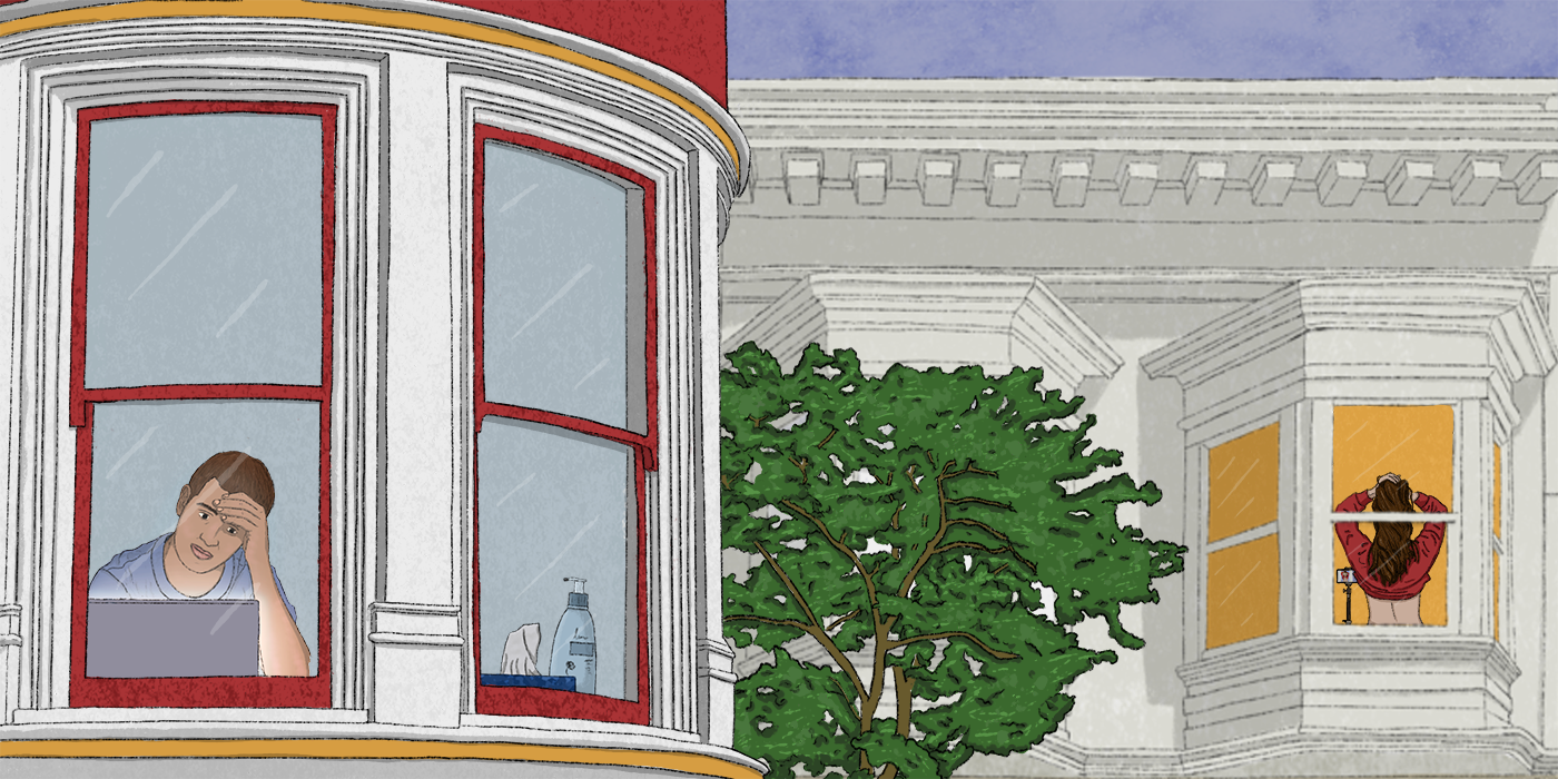 A person in a corner apartment looking at a laptop. One building over, a person does cam work near a window.