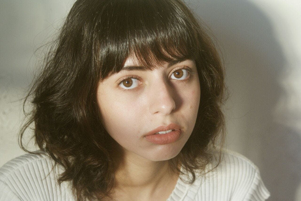 Luiza Queiroz Medium