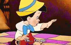 A gif of pinnochio shouting “I’m a real boy!”