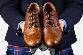 Ghillie brogues are traditional Scottish shoes that are typically worn with a kilt. They are characterized by their long laces, which wrap around the ankle and are tied below the calf. Ghillie brogues also have a distinctive brogue pattern, which is a type of decorative stitching.