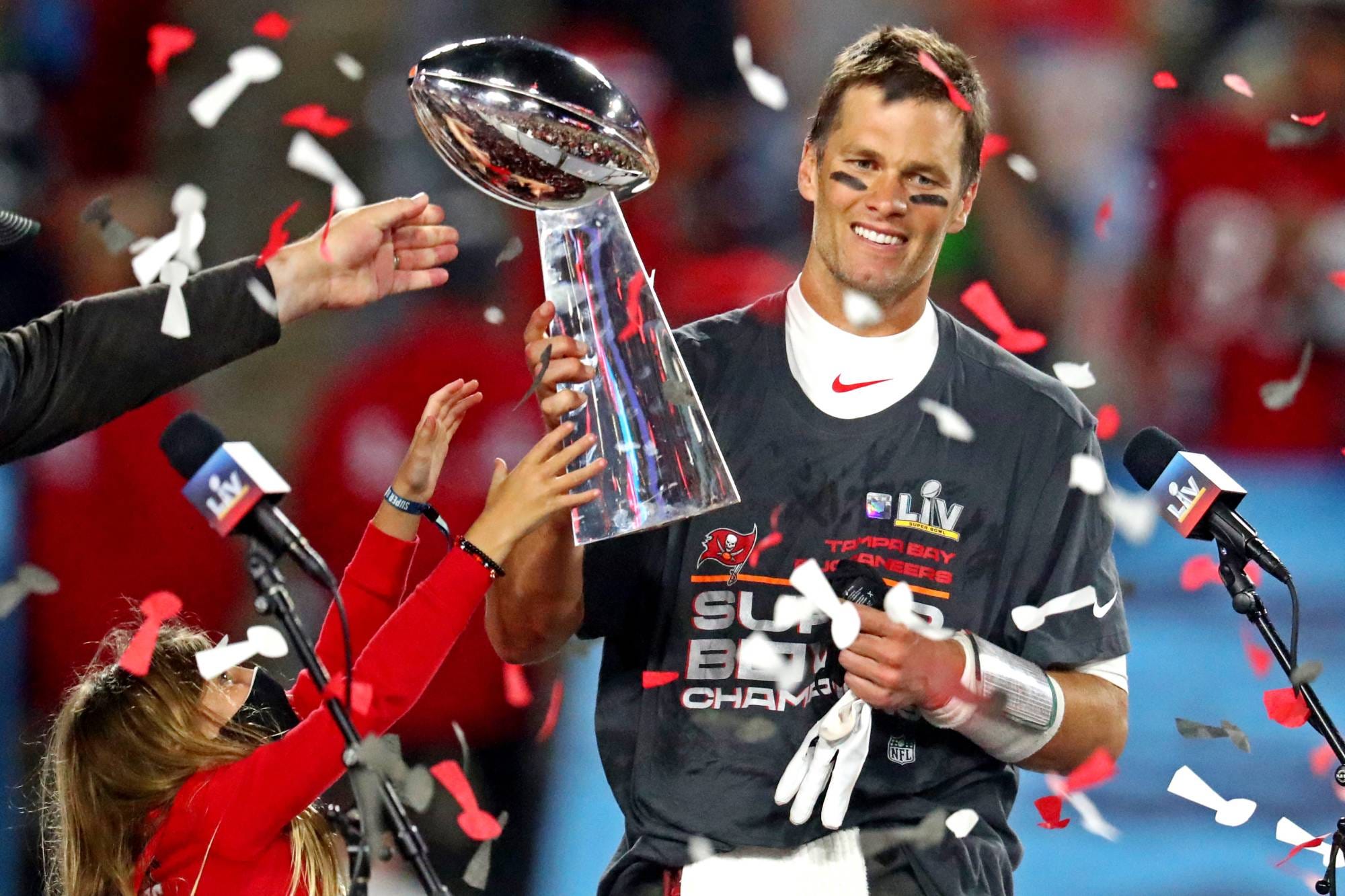 Photo: Denver Broncos' Corey Nelson hugs the Lombardi trophy after