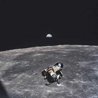 Apollo 11 Mission Image - View of Moon limb and Lunar Module during ascent, Mare Smythii, Earth on horizon