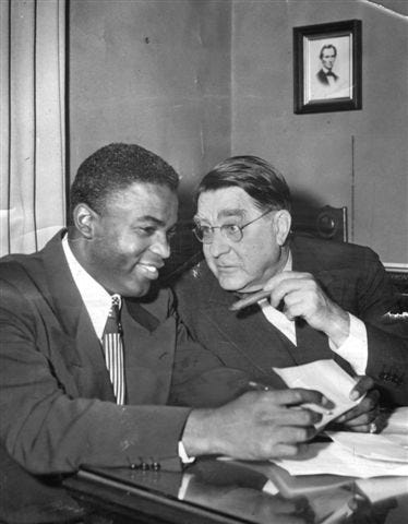 Jackie Robinson in Branch Rickey’s office; note portrait of Lincoln