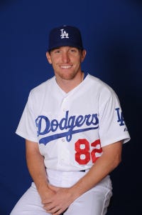 Los Angeles Dodgers bullpen catcher Steve Cilladi and teammates